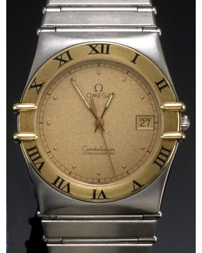 1067-RELOJ DE PULSERA OMEGA CONSTELLATION. CAJA Y BRAZALETE EN ACERO Y ORO AMARILLO DE 18K. MOVIMIENTO SUIZO DE CUARZO. Esfera dorada con numeración a pu