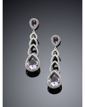 173-PENDIENTES COLGANTES DE AMATISTAS TALLA PERA 9.90 cts Y BRILLANTES 0.60 cts. sobre montura de oro blanco de 18k. 