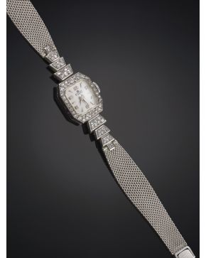 1012-BUCHERER RELOJ DE PULSERA  PARA SEÑORA. ELEGANTE CAJA EN ORO BLANCO Y DIAMANTES. PULSERSA EN MALLA DE ORO BLANCO DE 18 K.