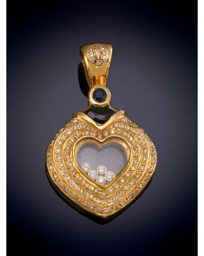 330-ELEGANTE COLGANTE CON DISEÑO DE CORAZÓN DECORADO POR BRILLANTES Y ZAFIROS sobre una montura en oro amarillo de 18K.