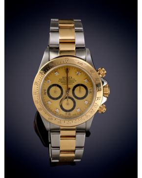 906- ROLEX OYSTER PERPETUAL" COSMOGRAPH DAYTONA. CAJA Y BRAZALETE EN ACERO Y ORO AMARILLO DE 18K. MOVIMIENTO AUTOMÁTICO. Esfera dorada con n