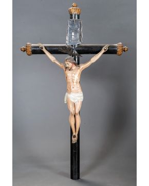 2216-"Cristo". Escultura en madera tallada y policromada sobre cruz. Desperfectos. Altura: 75 cm